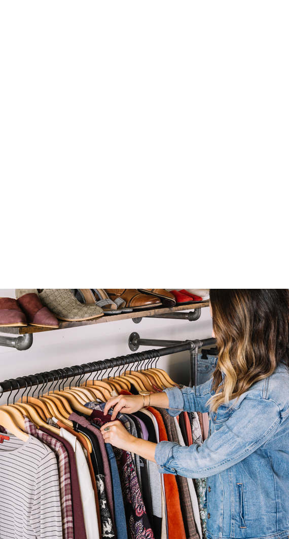 Woman looking thru Buckle clothing at a Buckle Store